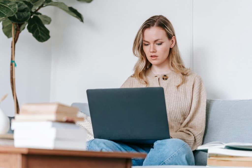 A female student is using her laptop