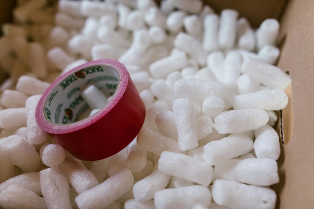 Packing tape and peanuts in a box