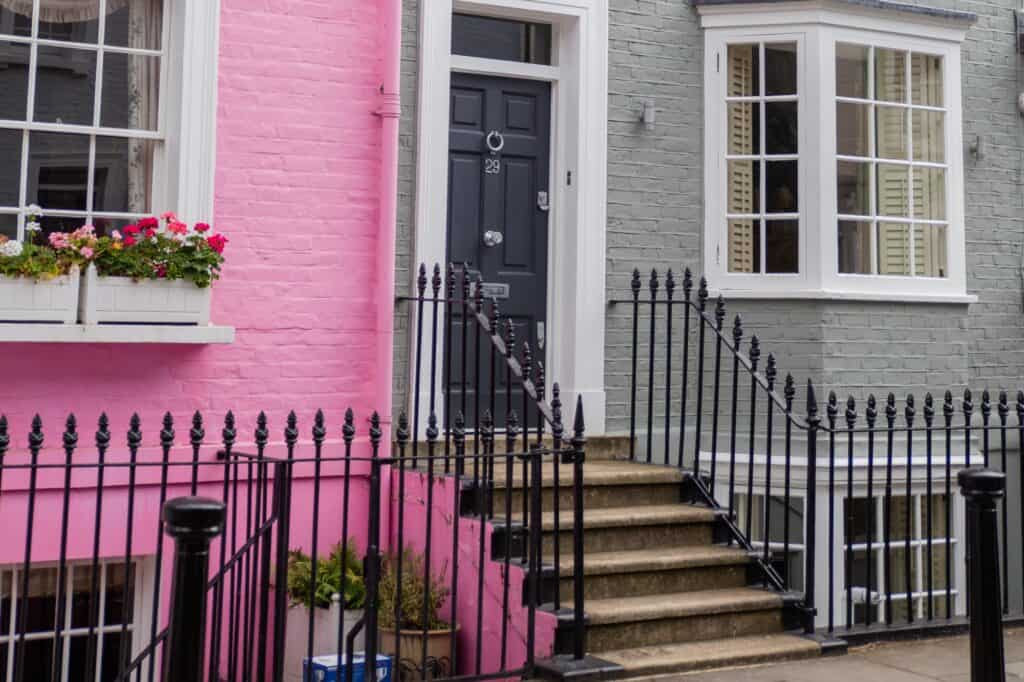 Pink and grey British houses with railings