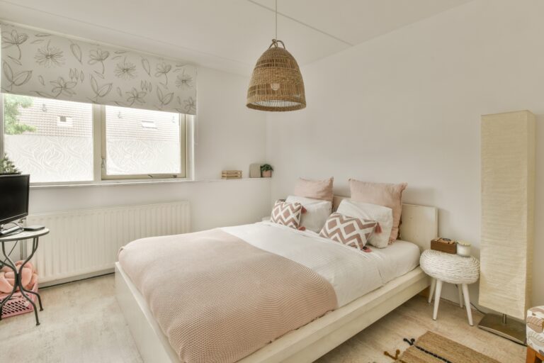 A queen-sized bed in a spacious bedroom in the concept of 'Types of Items Transported by a Man and Van'.