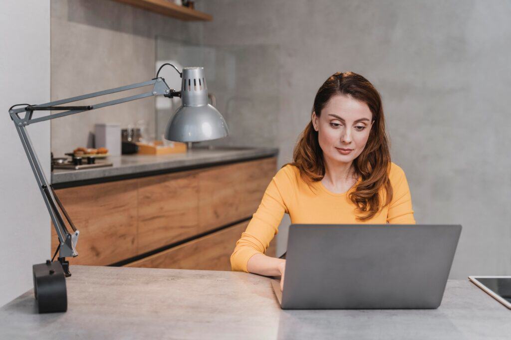 A woman booking Man and van services on her laptop