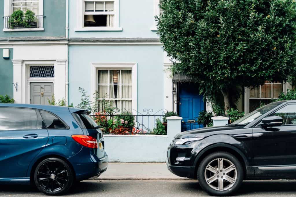 Cars parked outside where they are visible during the move